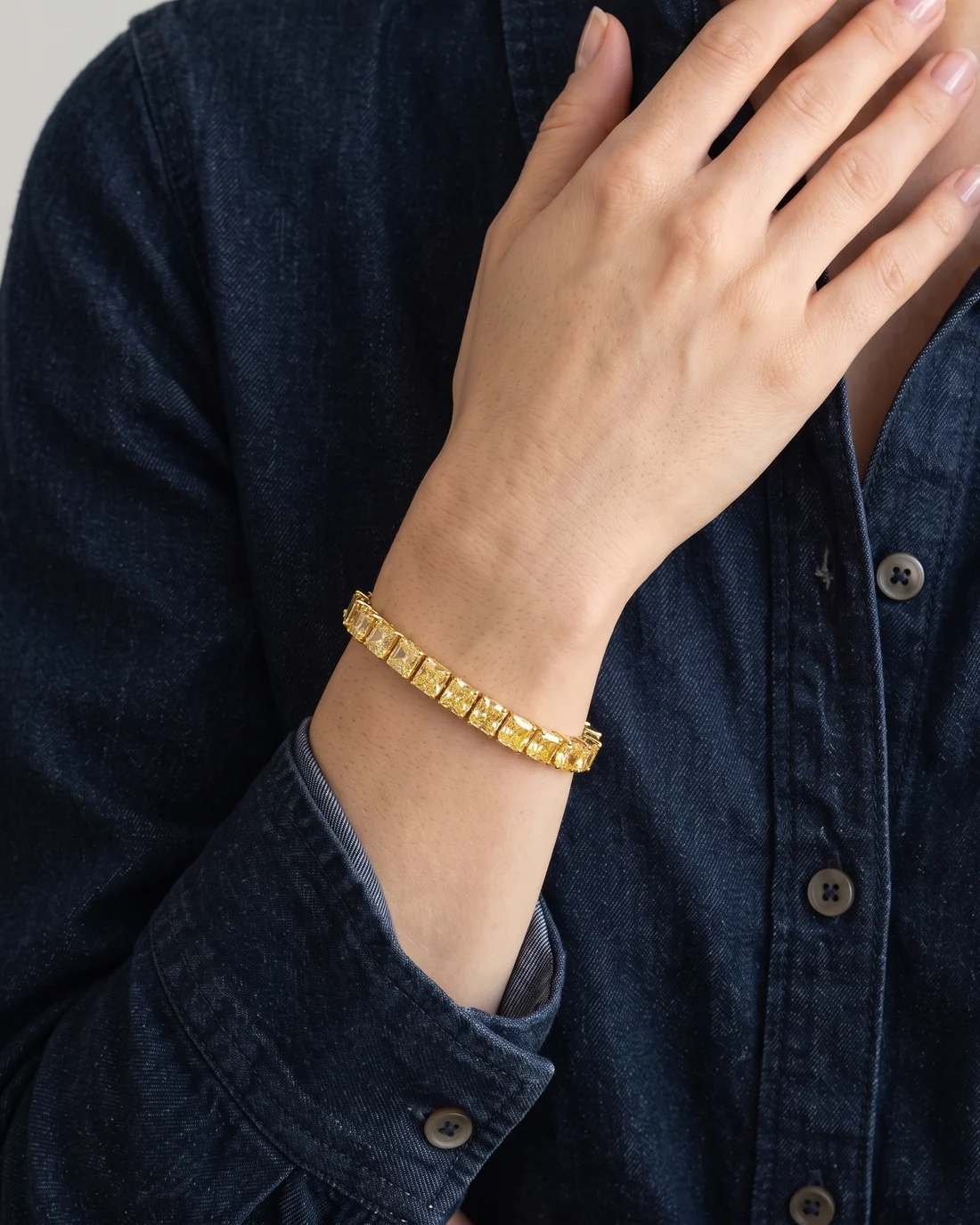 ORTIGAS Yellow Radiant Line bracelet, worn on the wrist