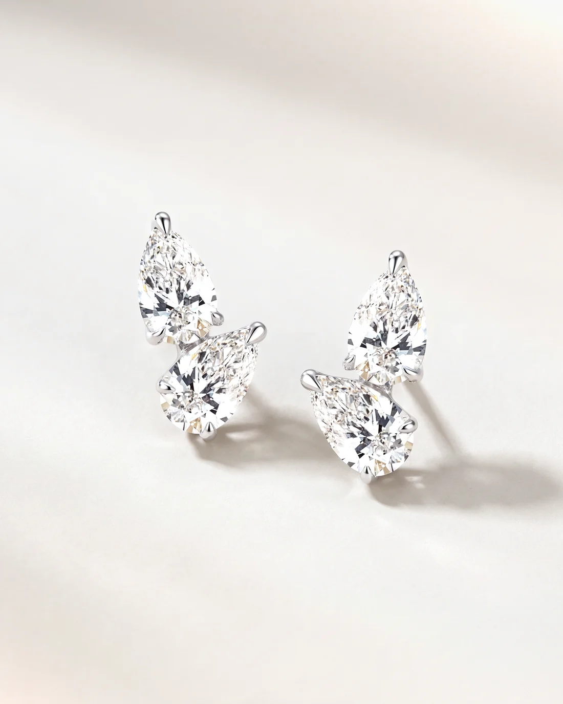 ORTIGAS Pear Climber earrings, front view