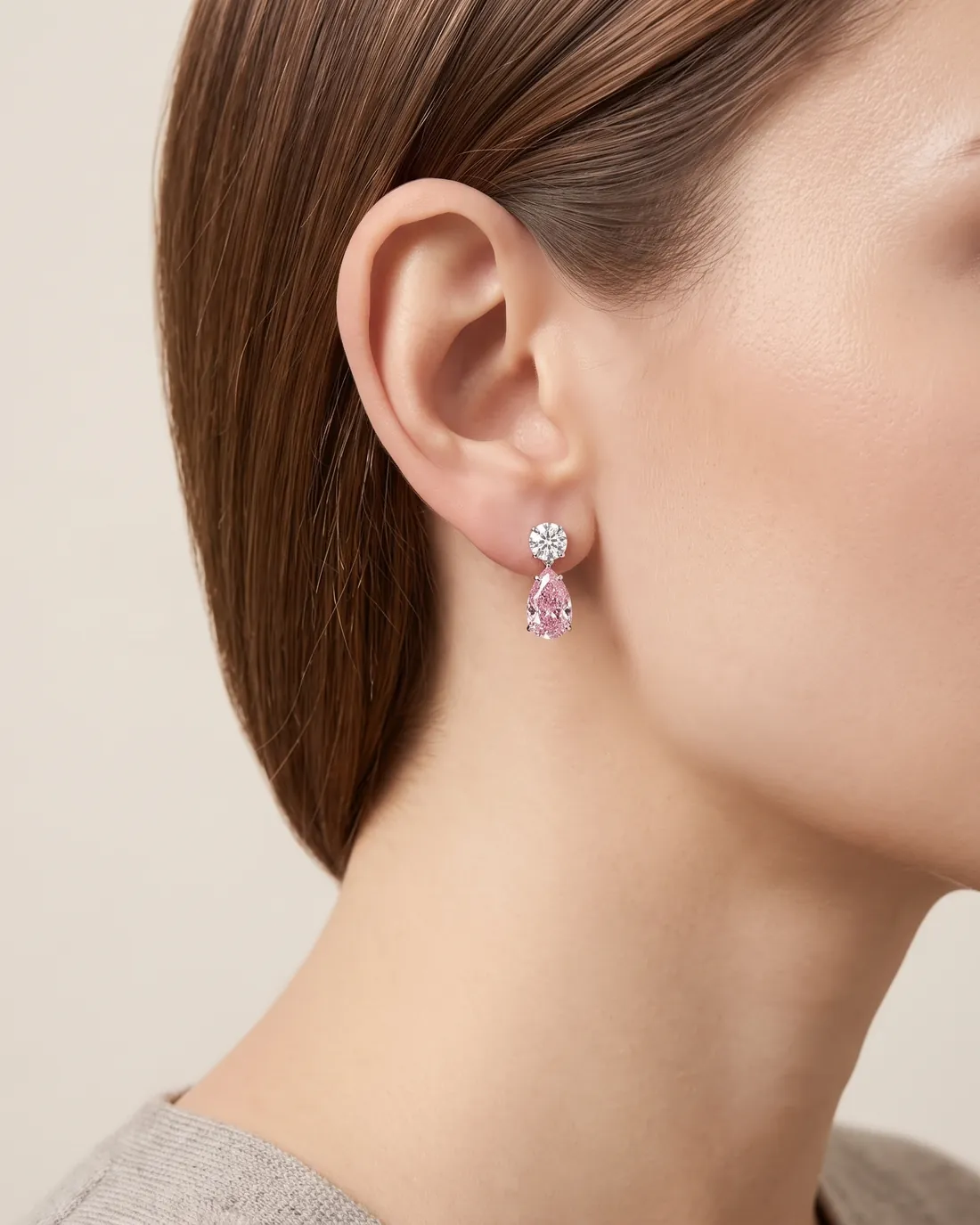 ORTIGAS Pink Pear Drops earrings, worn on the ear