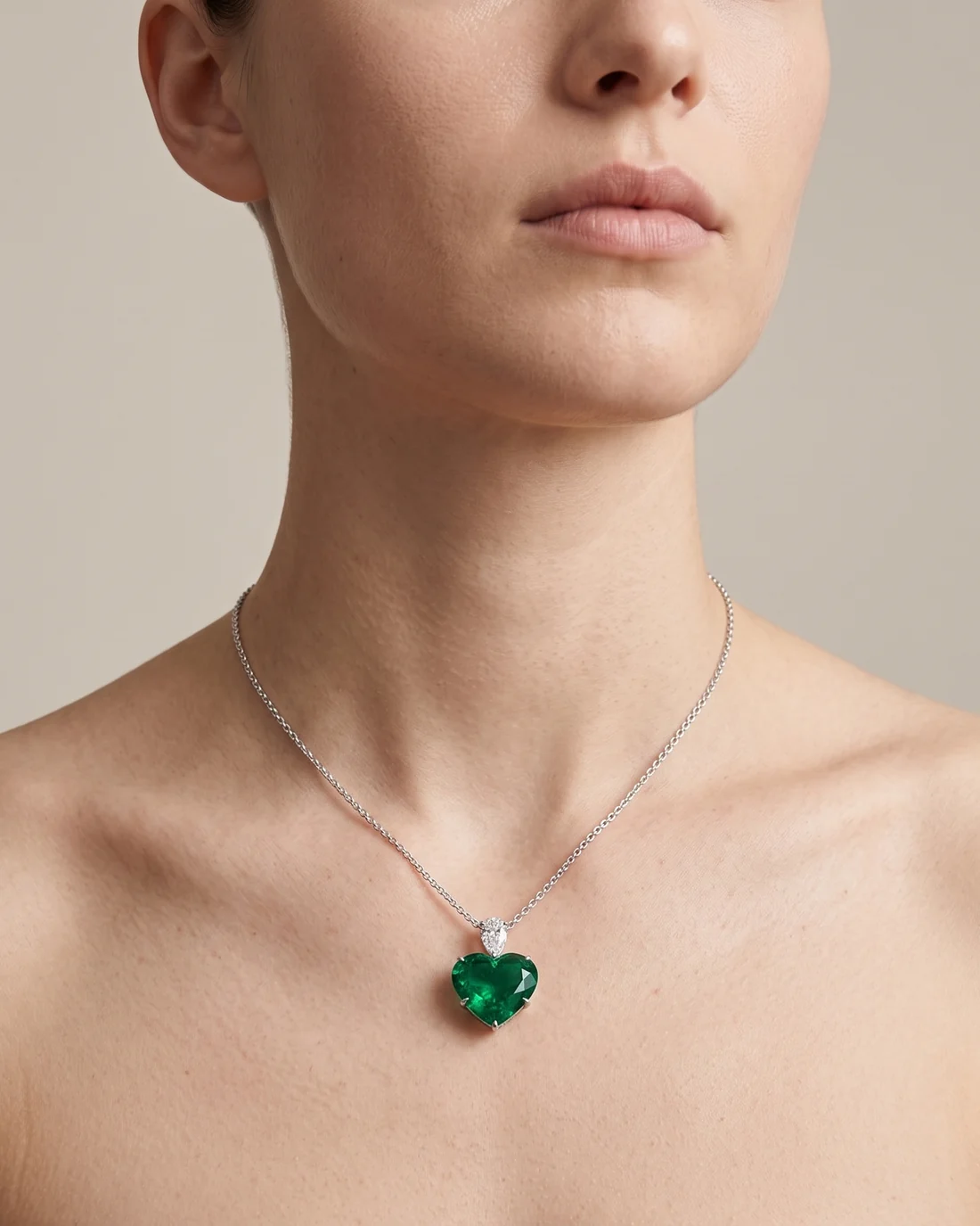 ORTIGAS Emerald Heart Drop necklace, worn on the neck