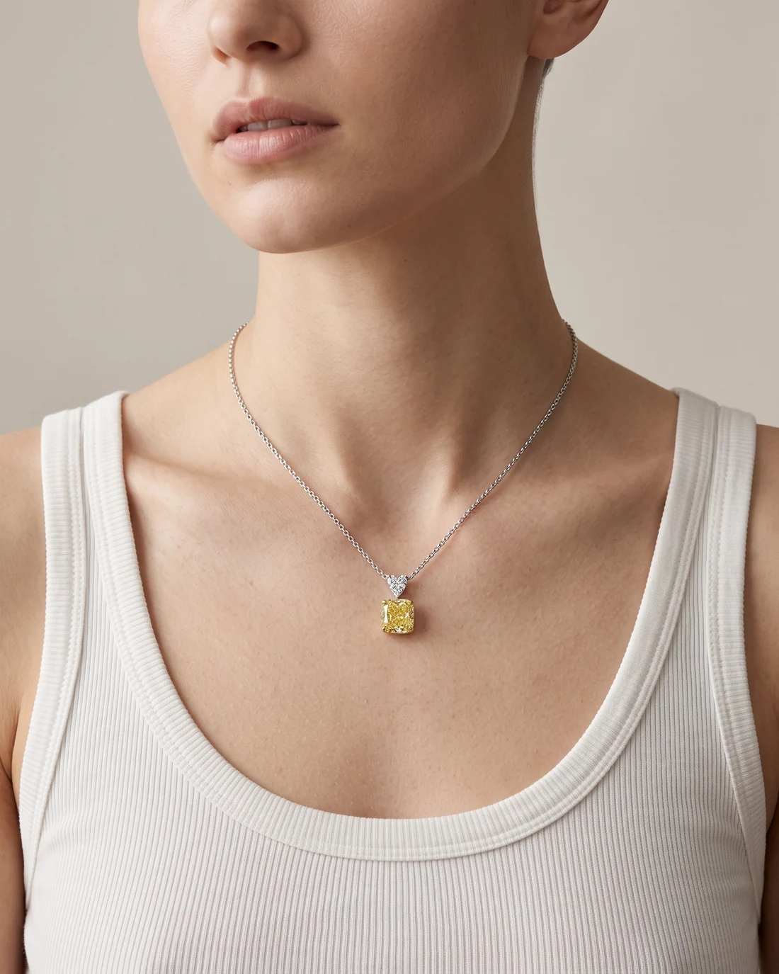 ORTIGAS Yellow Cushion Drop necklace, worn on the neck