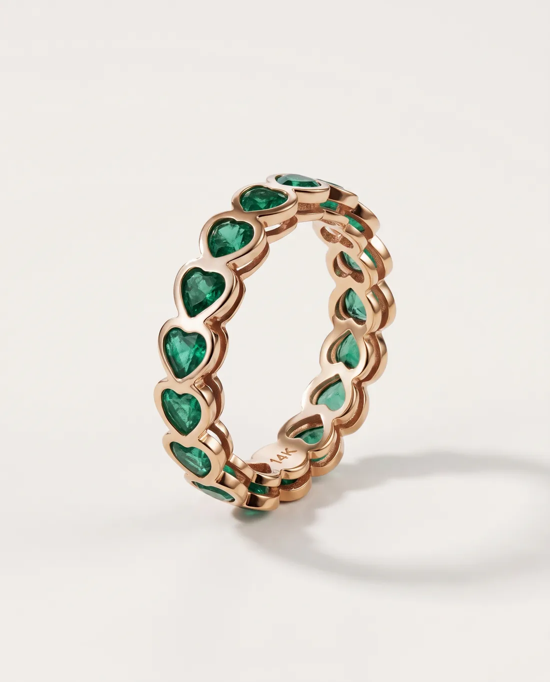 ORTIGAS Rose Emerald Band ring, three-quarter view