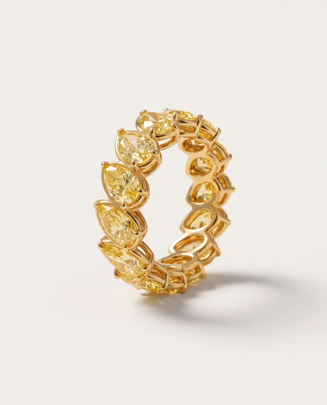 ORTIGAS Yellow Pear Eternity ring, three-quarter view
